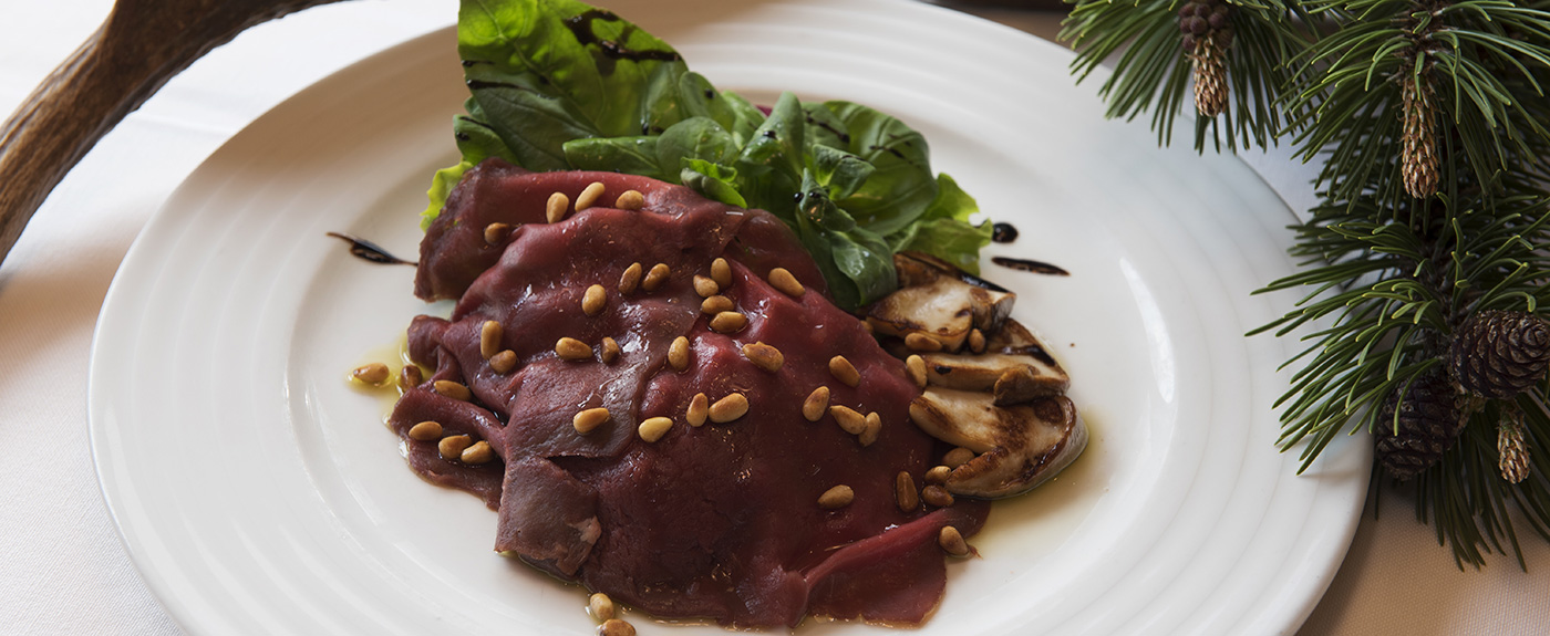 Meat with vegetables and garnishing on a plate