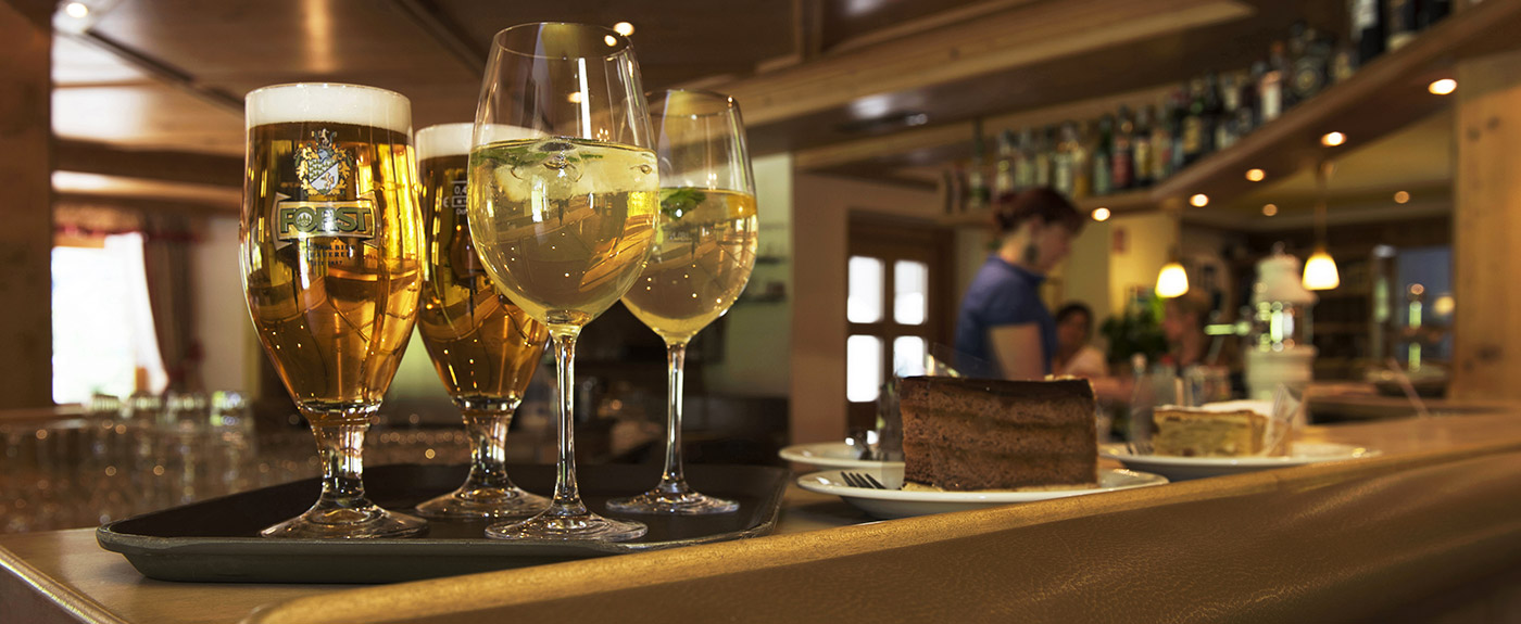 Drinking glasses and slices of cake at the hotel's bar